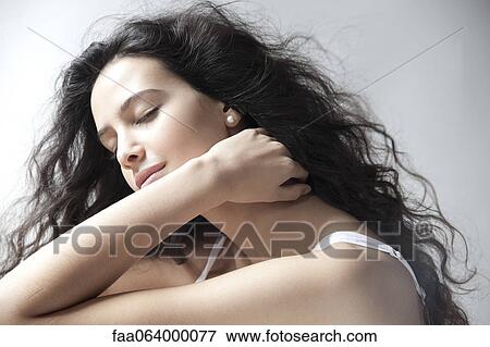 Yoing woman with eyes closed, portrait View Large Photo Image Stock Photo - Yoing woman with eyes closed, portrait. Fotosearch