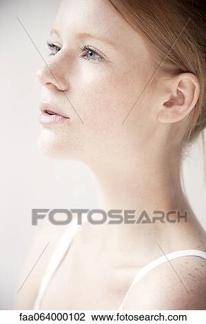 Young woman in profile, portrait View Large Photo Image Stock Image - Young woman in profile, portrait. Fotosearch