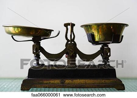 Stock Image - Antique two pan balance scale. Fotosearch