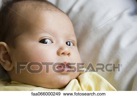 Baby glancing sideways at camera, portrait View Large Photo Image Stock Photo - Baby glancing sideways at camera, portrait. Fotosearch