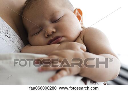 Baby sleeping on parent's shoulder, cropped View Large Photo Image Stock Image - Baby sleeping on parent's shoulder, cropped. Fotosearch
