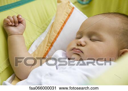 Stock Image - Baby sleeping, portrait. Fotosearch