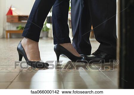 Couple standing face to face, cropped view of feet View Large Photo Image Stock Image - Couple standing face to face, cropped view of feet. Fotosearch