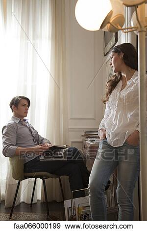 Couple talking together at home View Large Photo Image Stock Photo - Couple talking together at home. Fotosearch