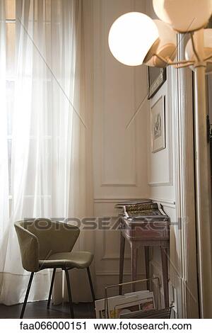 Empty chair and magazine on desk in home interior View Large Photo Image Stock Image - Empty chair and magazine on desk in home interior. Fotosearch