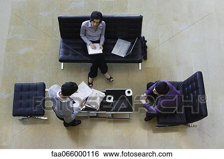 Executives working together, overhead view View Large Photo Image Stock Photograph - Executives working together, overhead view. Fotosearch