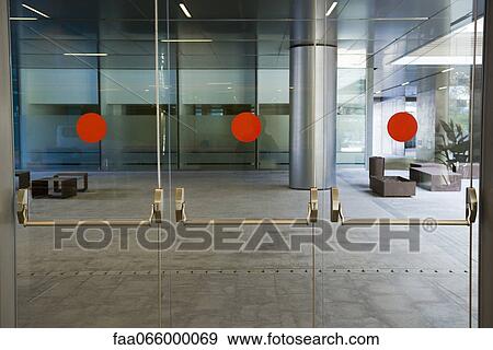 Glass doors of office building View Large Photo Image Stock Photo - Glass doors of office building. Fotosearch