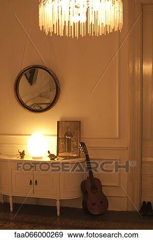 Home interior lit by lamp and chandelier View Large Photo Image Stock Photo - Home interior lit by lamp and chandelier. Fotosearch