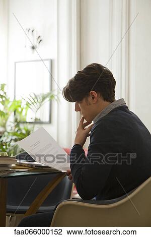 Man reading over employment contract View Large Photo Image Stock Image - Man reading over employment contract. Fotosearch