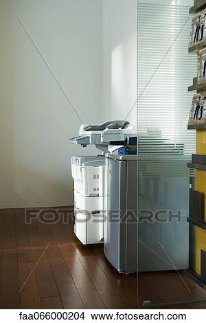 Photocopier in corner of office View Large Photo Image Picture - Photocopier in corner of office. Fotosearch
