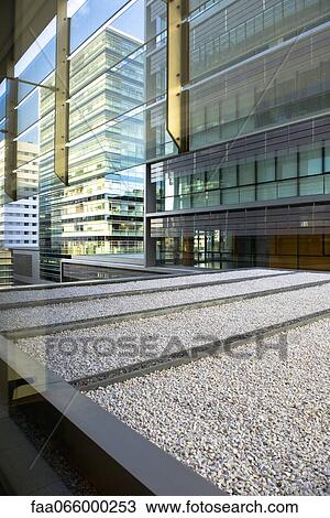 Roof of office building seen through window View Large Photo Image Stock Image - Roof of office building seen through window. Fotosearch