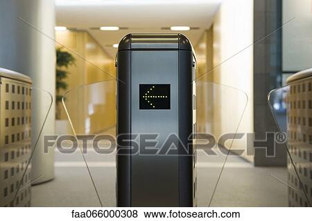 Turnstile in office building lobby View Large Photo Image Stock Photo - Turnstile in office building lobby. Fotosearch