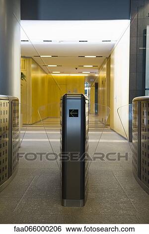 Turnstile in office building lobby View Large Photo Image Stock Photograph - Turnstile in office building lobby. Fotosearch