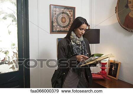 Woman opening her mail View Large Photo Image Stock Photo - Woman opening her mail. Fotosearch