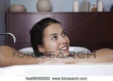Woman relaxing in bath, portrait View Large Photo Image Stock Image - Woman relaxing in bath, portrait. Fotosearch