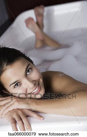 Woman relaxing in bath, portrait View Large Photo Image Stock Photo - Woman relaxing in bath, portrait. Fotosearch