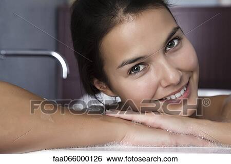 Woman relaxing in bath, portrait View Large Photo Image Stock Photograph - Woman relaxing in bath, portrait. Fotosearch