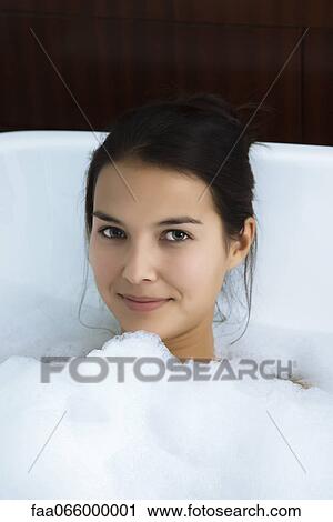 Woman relaxing in bubble bath, portrait View Large Photo Image Stock Image - Woman relaxing in bubble bath, portrait. Fotosearch