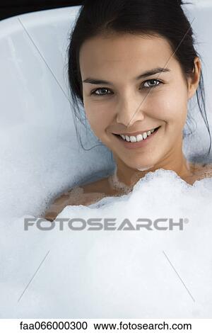 Woman relaxing in bubble bath, portrait View Large Photo Image Stock Image - Woman relaxing in bubble bath, portrait. Fotosearch