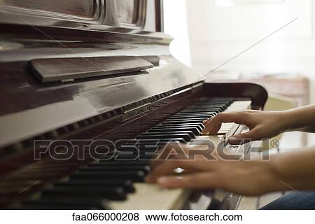 Woman's hands playing piano View Large Photo Image Stock Photo - Woman's hands playing piano. Fotosearch