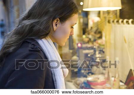 Young woman shopping View Large Photo Image Stock Photograph - Young woman shopping. Fotosearch
