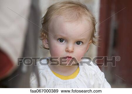 Stock Photo - Baby girl, portrait. Fotosearch