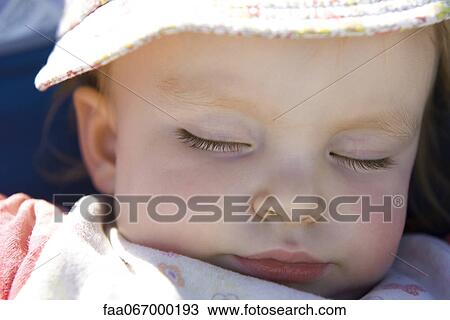 Stock Image - Baby girl sleeping, portrait. Fotosearch