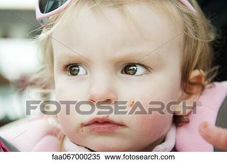 Baby girl with messy face, portrait View Large Photo Image Stock Photography - Baby girl with messy face, portrait. Fotosearch