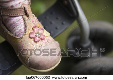 Stock Image - Baby girl's shoe, close-up. Fotosearch