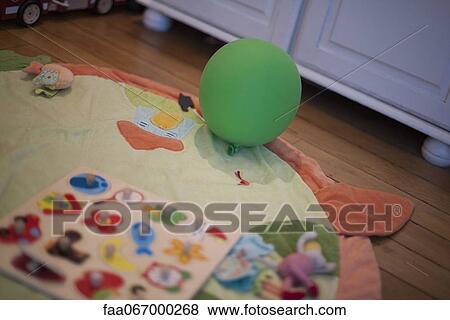 Balloon and toys on floor View Large Photo Image Stock Photo - Balloon and toys on floor. Fotosearch
