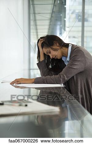 Businesswoman holding head with eyes closed View Large Photo Image Stock Photograph - Businesswoman holding head with eyes closed. Fotosearch