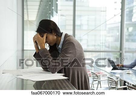 Businesswoman stressing over work View Large Photo Image Stock Image - Businesswoman stressing over work. Fotosearch