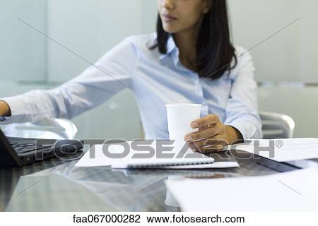 Businesswoman using laptop, cropped View Large Photo Image Stock Image - Businesswoman using laptop, cropped. Fotosearch