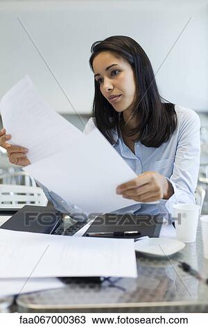 Stock Image - Businesswoman working. Fotosearch