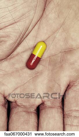Capsule in palm of man's hand View Large Photo Image Stock Image - Capsule in palm of man's hand. Fotosearch