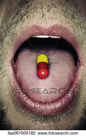 Capsule on man's tongue, close-up View Large Photo Image Stock Image - Capsule on man's tongue, close-up. Fotosearch