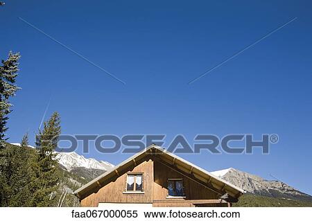 Chalet against blue sky, cropped View Large Photo Image Stock Photography - Chalet against blue sky, cropped. Fotosearch