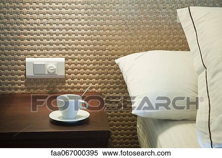 Coffee cup on bedside table View Large Photo Image Stock Photography - Coffee cup on bedside table. Fotosearch