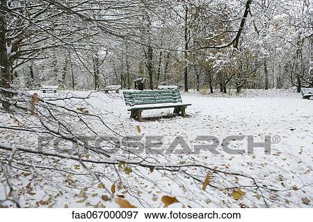 Empty park bench covered in snow View Large Photo Image Stock Photo - Empty park bench covered in snow. Fotosearch