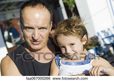 Father and young daughter together outdoors, portrait View Large Photo Image Stock Photograph - Father and young daughter together outdoors, portrait. Fotosearch