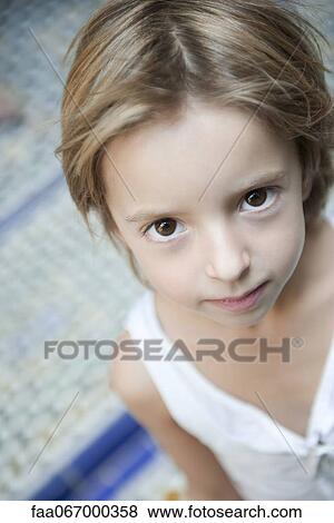 Girl looking up at camera, portrait View Large Photo Image Stock Photo - Girl looking up at camera, portrait. Fotosearch