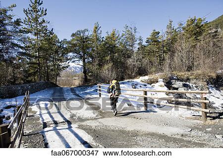 Hiker carrying baby in backpack carrier View Large Photo Image Stock Photo - Hiker carrying baby in backpack carrier. Fotosearch