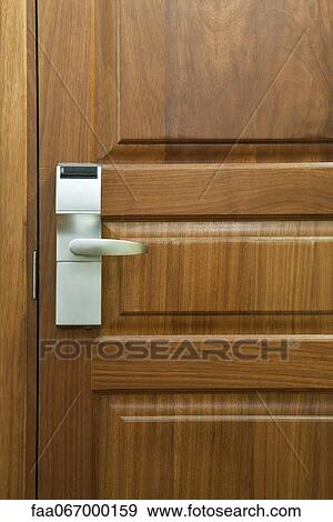 Stock Photo - Hotel room door with electronic door lock, full frame. Fotosearch