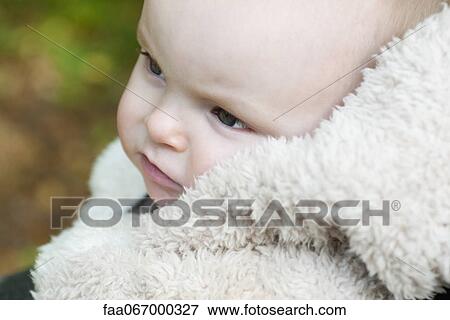 Infant wrapped in blanket, portrait View Large Photo Image Stock Photo - Infant wrapped in blanket, portrait. Fotosearch