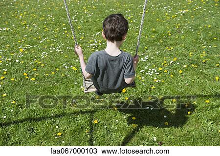 Little boy on swing, rear view View Large Photo Image Stock Image - Little boy on swing, rear view. Fotosearch