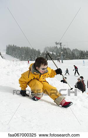 Little boy playing on ski slope View Large Photo Image Stock Photography - Little boy playing on ski slope. Fotosearch