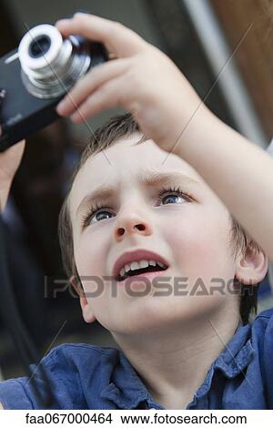 Little boy using digital camera View Large Photo Image Picture - Little boy using digital camera. Fotosearch
