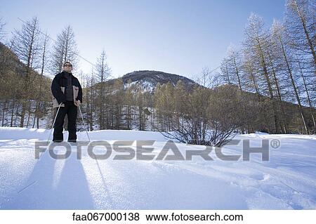 Stock Photo - Man enjoying winter outdoors. Fotosearch