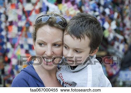Mother and son embracing, portrait View Large Photo Image Stock Photography - Mother and son embracing, portrait. Fotosearch