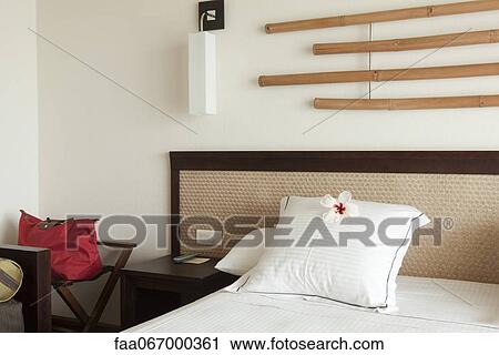 Neatly made hotel bed, travel bag next to the bed View Large Photo Image Stock Image - Neatly made hotel bed, travel bag next to the bed. Fotosearch